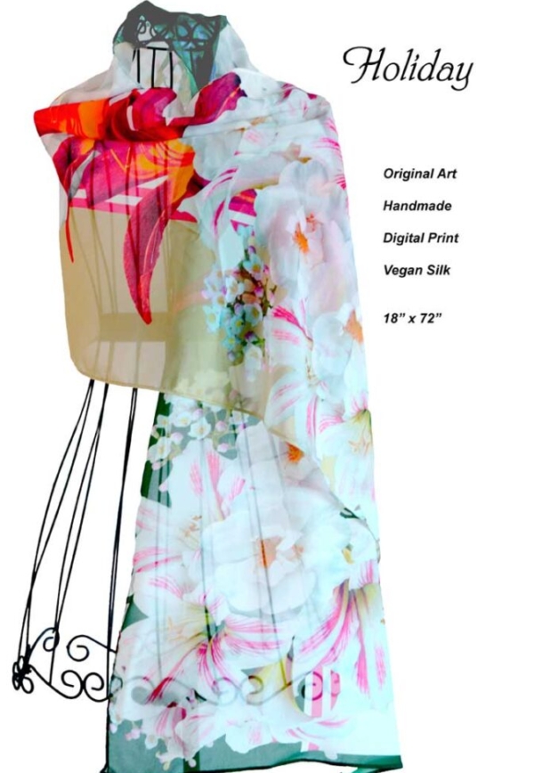 White Poinsettia, red lilies, dark green borders, chiffon scarf